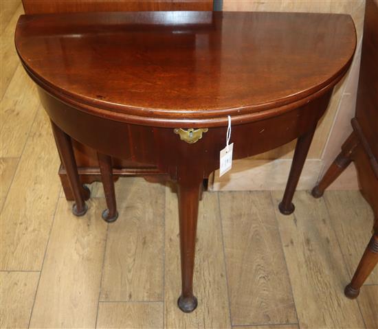 A George III mahogany twin fold over tea table W.80cm